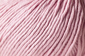 Close-up image of Jo Sharp Soho Summer DK Cotton yarn by Kingfisher Yarn & Fibre. The soft, pale pink cotton showcases tightly coiled strands with visible twists and folds, creating a plush, cozy appearance. This lightweight yarn appears thick and suitable for knitting or crocheting projects.