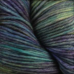 Close-up image of soft, multicolor sport weight superwash merino wool yarn by Malabrigo Yarn. The colors blend predominantly in shades of green, blue, and purple, creating a visually appealing and harmonious pattern. This Malabrigo Arroyo yarn appears to be thick and evenly spun, ideal for knitting lightweight garments.