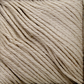 Close-up image of cream-colored Cascade Ultra Pima Cotton Yarn by Cascade Yarns, showcasing tightly twisted strands. The texture, made from Peruvian Pima Cotton, appears soft and smooth, ideal for knitting or crocheting. The yarn loops are neatly aligned side by side, creating a uniform pattern across the image.