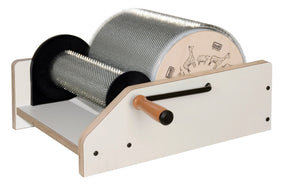 The Louët 12" XL Drum Carder by Louët Inc. is a wooden drum carder with a hand crank designed for processing wool fibers. It features two cylindrical drums covered in metal pins and an end plate adorned with drawings of a llama, alpaca, and camel.
