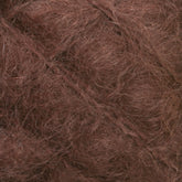 Close-up image of a Victorian Brushed Mohair Yarn Mini Skein from Caledonian Dye Works, featuring a rich, fuzzy texture. The intertwined natural fibers create a luxurious appearance with warm brown shades for a variegated look reminiscent of mohair.