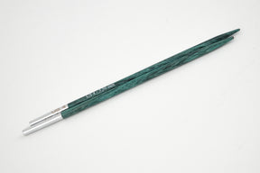 Two Dreamz Interchangeable Knitting Needle Tips in green wood, featuring silver-colored tips, from Accessories Unlimited, are laid parallel on a plain white background. Perfect for knitting hats.