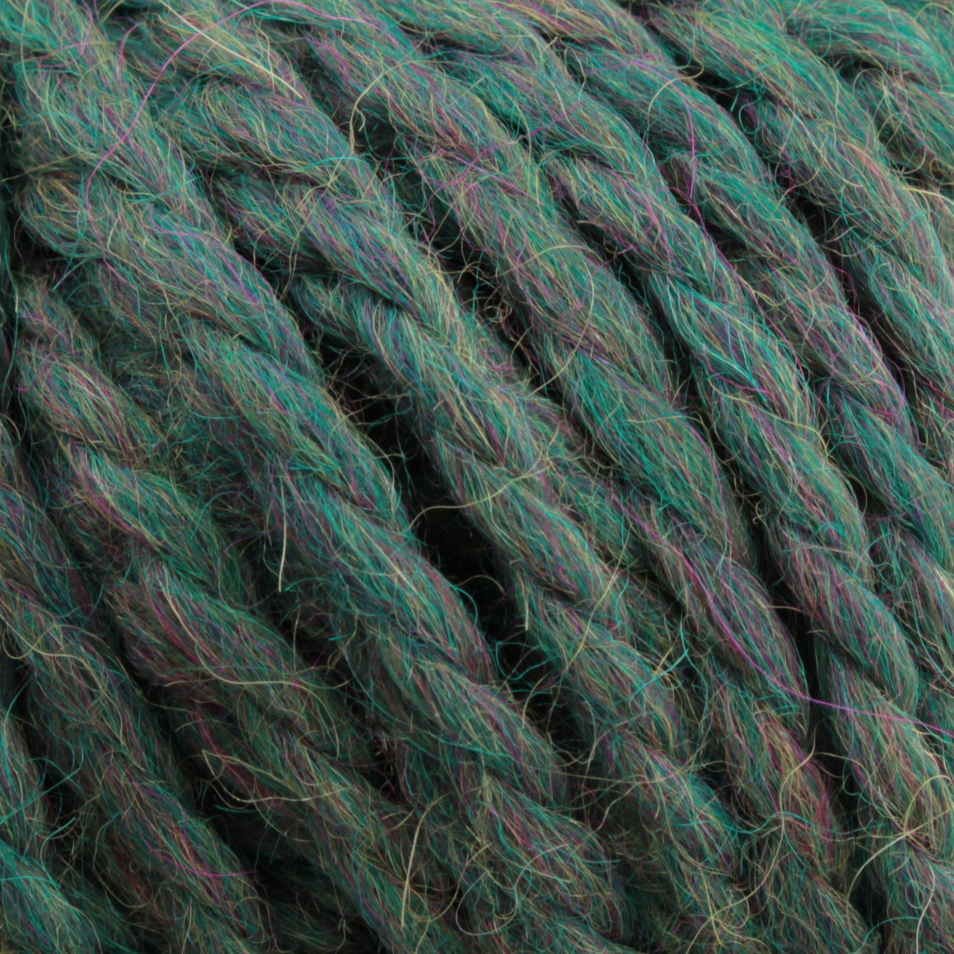 Close-up of the thick, twisted Baby Alpaca Grande by Plymouth Yarn Co., which is predominantly green with subtle purple and blue hues interwoven, giving it a multicolored appearance. The texture is ultra-soft and wool-like.