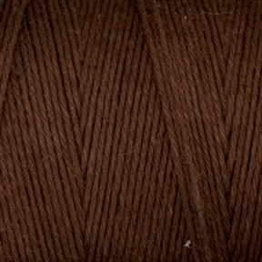 Close-up image of Maurice Brassard's Medium Cotton 16/8 Mop Yarn, dark brown and tightly wound with visible strand patterns running diagonally across. The texture appears soft and slightly fuzzy, indicative of its cotton composition, making it perfect for knitting projects.