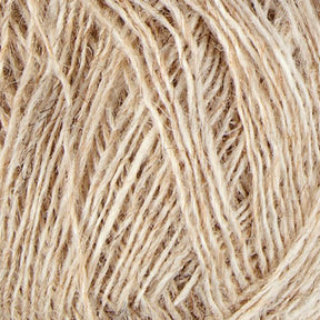 A close-up image of natural, beige-colored Einband Lopi Icelandic wool yarn by Berroco, Inc. The fibers are intertwined, displaying a slightly rough texture. The yarn strands are loosely wound, providing a detailed view of the individual threads perfect for lace knitting projects.