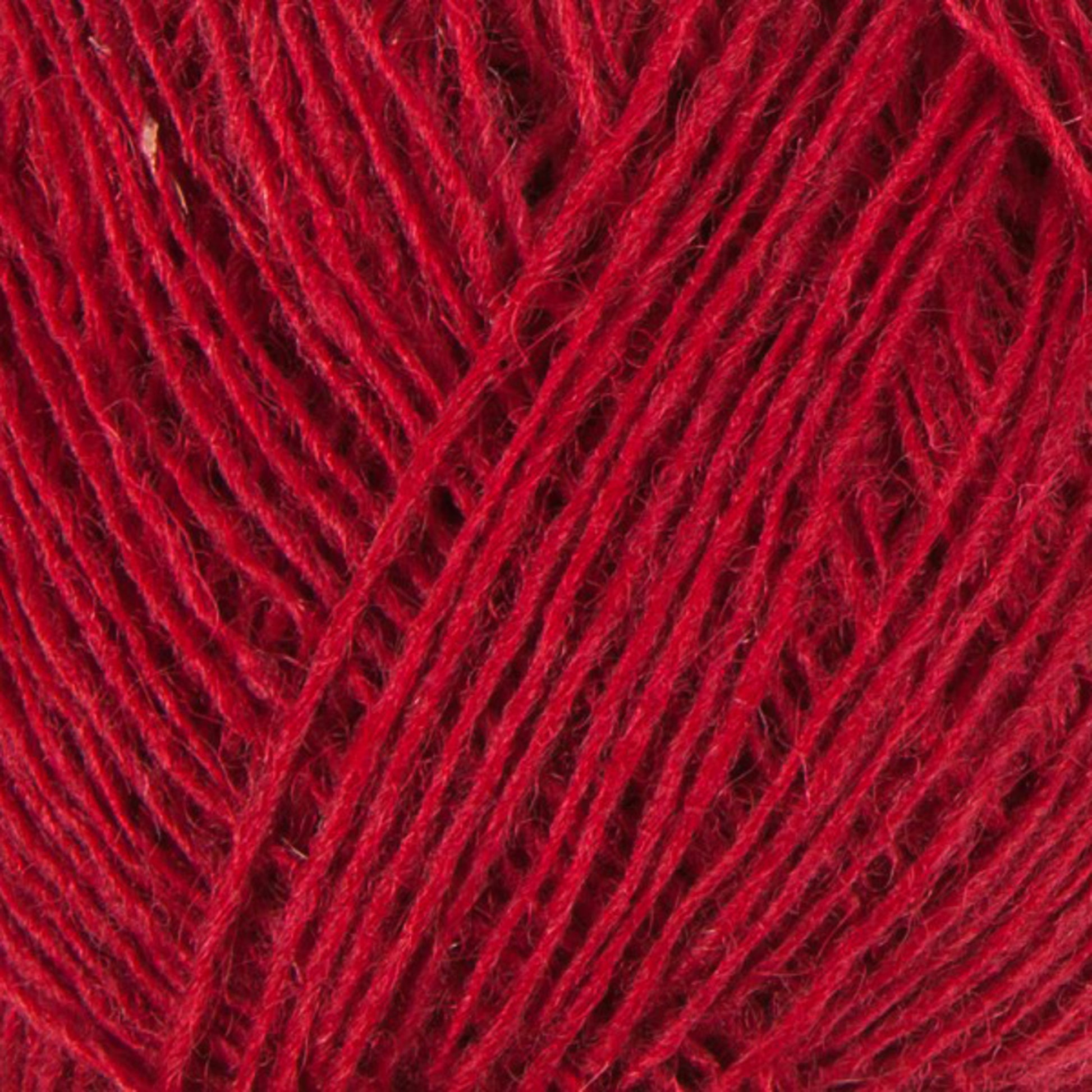 Close-up image of a bundle of Einband Lopi red yarn by Berroco, Inc. The tightly wound strands showcase a vibrant, rich color with visible texture, capturing the details of the fibers. Ideal for colorwork or lace knitting, the image highlights the thickness and structure unique to high-quality Icelandic wool.