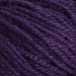 Close-up of the soft, tightly wound Halcyon Deco Rug Wool yarn in a rich, deep purple color. The individual strands are clearly visible, showcasing a textured and slightly fuzzy surface. This 100% wool yarn by Caledonian Dye Works is perfect for versatile projects.