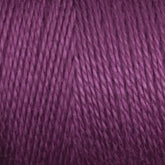 Close-up image of a Maurice Brassard 16/2 Bamboo Yarn skein in purple. The texture is smooth with fibers closely packed together, displaying a consistent color throughout. The image highlights the detailed threads and soft texture of this sustainable and antibacterial yarn.