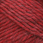 A close-up image showcases the vibrant red Lamb's Pride Bulky Yarn from Brown Sheep, featuring a soft, slightly fuzzy texture. The yarn strands are tightly twisted together, creating a thick and robust appearance. Interspersed thin, lighter-colored fibers add depth to the overall hue—ideal for knitters and crocheters creating Icelandic sweaters.