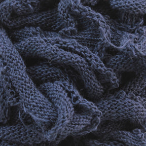 A close-up view of tangled dark blue Harrisville Potholder Loops - Traditional Size Mini Pack. The texture showcases intricate patterns of cotton loops and stitches, creating a detailed and somewhat chaotic appearance from the Friendly Loom brand.