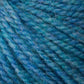 Close-up of blue and green variegated Bartletts Maine Wool - Sport by Bartlettyarns. The image shows tightly twisted strands of sport weight yarn with a soft, woolly texture, blending shades of blue and green throughout. The fibers are slightly fuzzy, creating a cozy and textured appearance.