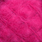 A close-up view of a ball of fuzzy, bright pink Victorian Brushed Mohair Yarn | Mini Skein by Caledonian Dye Works. The fibers are soft and wispy, creating a vibrant and textured appearance. Made from luxurious mohair, the shades of pink vary slightly, giving depth to the yarn's color.