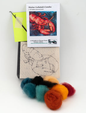 The "Thyme Tile" needle felting kit from A Wrinkle in Thyme Farm, perfect for beginner felters, includes a red lobster image, a felting needle, rolls of colored wool roving (red, yellow, green, white, and black), and a base with a lobster sketch.