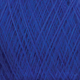 Close-up image of a ball of JaggerSpun Maine Line 2/20 Yarn from Jagger Brothers, Inc., showcasing the texture and intricate crisscrossing pattern of the fibers. The medium grade wool appears soft and fluffy, with various shades of blue creating depth.