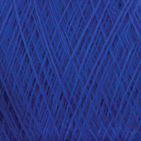 Close-up image of a ball of JaggerSpun Maine Line 2/20 Yarn from Jagger Brothers, Inc., showcasing the texture and intricate crisscrossing pattern of the fibers. The medium grade wool appears soft and fluffy, with various shades of blue creating depth.