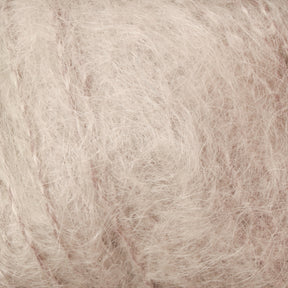 Here's a close-up of the Victorian Brushed Mohair Yarn | Mini Skein by Caledonian Dye Works. The luxurious texture is both fluffy and smooth, with fine fibers that give it a light and airy appearance. This natural fiber yarn seems perfect for creating cozy knits.