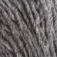 Close-up image of Jöklalopi (Bulky Lopi) yarn by Berroco, Inc. The fibers are intertwined and display a fuzzy, soft appearance, highlighting the natural variability and thickness of the strands. This evokes the rustic handmade charm often found in chunky winter sweaters with natural colors.