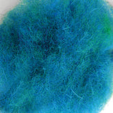 Close-up of a bundle of Harrisville Designs' Harrisville Dyed & Carded Wool Fiber in vibrant blue and green hues, intertwined randomly to create a fluffy and textured appearance. The felting wool features a fuzzy, tangled look with a mix of fine and coarse strands, highlighting its heathered colors.