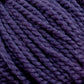 Close-up image of Norumbega Aran weight yarn by Caledonian Dye Works, showcasing its tightly twisted strands and soft, fibrous texture. Made from 100% U.S. wool, the yarn appears cozy and suitable for knitting or crocheting projects.