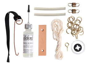 The Ashford Spinning Wheel Maintenance & Repair Kit from Ashford Handicrafts Limited includes essential spinning wheel accessories and spare parts such as a bottle of spinning wheel oil with applicator, a leather strap, nylon cords, screws, hooks, clamps, and small components neatly arranged on a white background—ideal for maintaining Ashford wheels.