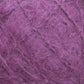 Close-up image of a ball of Victorian Brushed Mohair Yarn from Caledonian Dye Works, with luxurious and fuzzy texture. The large skein showcases strands intertwined in a slightly disordered manner. The yarn appears soft and fluffy, with fibers sticking out, giving it a textured and slightly frizzy appearance reminiscent of traditional Victorian yarns.