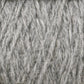 A close-up image of a tightly coiled bundle of Harrisville Shetland Yarn - Unwashed Cones from Harrisville Designs, showing detailed textures and fibers. The yarn appears thick and soft, with slightly varying shades of gray—ideal for Fair Isle knitting designs or crafting lightweight blankets.