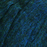 Close-up image showcasing a textured surface featuring a blend of dark navy blue and lighter heathered colors intertwined. The material, reminiscent of Harrisville Dyed & Carded Wool Fiber from Harrisville Designs, has a slightly rough, matted appearance similar to felt or felting wool.