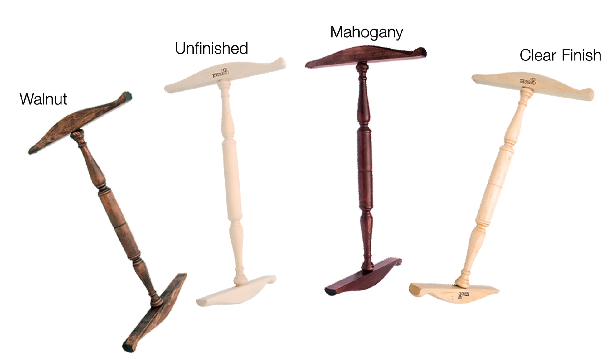 Four Kromski Niddy Noddy wooden shoehorns from Kromski North America are displayed. From left to right, their finishes are labeled: "Walnut," "Unfinished," "Mahogany," and "Clear Finish." These shoehorns feature long, turned handles and T-shaped ends with rounded edges.