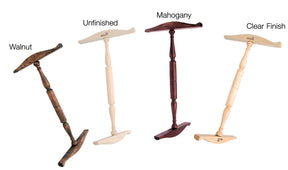 Four Kromski Niddy Noddy wooden shoehorns from Kromski North America are displayed. From left to right, their finishes are labeled: "Walnut," "Unfinished," "Mahogany," and "Clear Finish." These shoehorns feature long, turned handles and T-shaped ends with rounded edges.