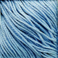 Close-up of soft, light blue Cascade Ultra Pima Cotton Yarn strands neatly arranged. The image highlights the smooth texture and even twist of the yarn fibers, showcasing their uniform color and slight sheen. Perfect for knitting or crochet projects with an incredibly soft hand from Cascade Yarns.