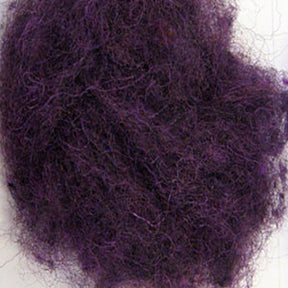 A tangled mass of frizzy, purple fibers, reminiscent of Harrisville Dyed & Carded Wool Fiber by Harrisville Designs. The texture appears coarse and wiry, with strands intertwined in a chaotic manner. The color is a deep, rich purple, enhanced by subtle heathered colors that create a striking and vibrant appearance.