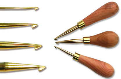 The image showcases four Ergo Handle Hartman Hooks from Dorr Fabrics Inc, aligned side by side. Each tool features brass tips and handcrafted light-colored yew wood handles. The tips come in various shapes, such as hooks and pointed ends, tailored for diverse sculpting techniques. The ergonomic yew wood handles ensure comfort during use.