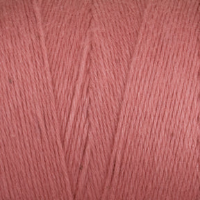 Close-up of Maurice Brassard's Medium Cotton 16/8 Mop Yarn in pink, showcasing the texture and fibers of the sturdy cotton yarn. The strands are uniformly colored and neatly arranged, perfect for knitting projects that highlight the smooth consistency of this material.