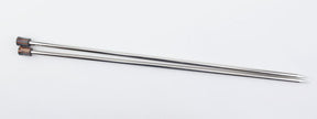 Two Accessories Unlimited Nova Platina Single Point Knitting Needles with pointed tips, placed parallel to each other on a plain white background. The straight needles feature wooden caps at one end, showcasing their sleek design made of hollow brass pipes.