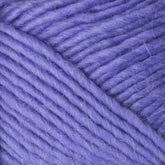 Close-up image of soft, thick, purple Lamb's Pride Worsted Yarn by Brown Sheep. The fibers are tightly wound together, showcasing their smooth and slightly fuzzy texture. The yarn appears plush and suitable for knitting or crocheting cozy projects like Navajo style weaving.