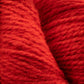 Close-up of two skeins of Bartlettyarns Maine Wool Yarn, exhibiting a thick, textured appearance. The worsted weight strands are tightly wound, highlighting a rich and vibrant heathered red color with visible fibers.