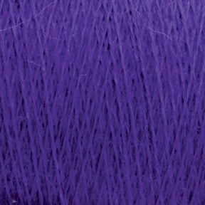 Close-up image of JaggerSpun Maine Line 2/20 Yarn from Jagger Brothers, Inc., showing its fine, tightly woven fibers and smooth texture. The vibrant purple hue is vivid and consistent throughout the material, capturing the intricate details and patterns of the strands. This yarn exemplifies medium grade wool with its worsted spun quality.