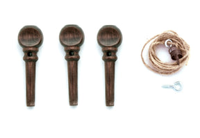 Three brown pegs from the Kromski Brake Band Set for Polonaise are aligned vertically on the left side, while a bundle of beige hemp string with a small hook and an additional brown peg is placed on the right side, all set against a white background. This arrangement perfectly showcases the Kromski North America product.