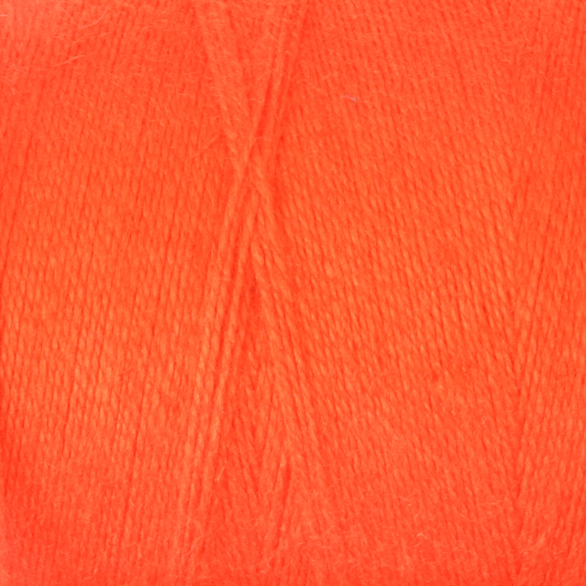 A close-up image of a soft, bright orange Mini-Cone of 8/2 Cottolin Organic Yarn by Maurice Brassard, with individual strands visible, showcasing its texture and fiber detail. The cotton linen blend yarn appears smooth and evenly wound, perfect for creating items like a Cottolin Tea Towel Kit.