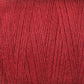 Close-up image of a spool of Maurice Brassard 8/2 Cottolin Organic Yarn in red. The fibers are tightly wound, showcasing the texture and richness of the color. The yarn appears smooth and evenly spun, making it ideal for weaving on a four shaft loom or pairing with a cotton linen blend for knitting or crocheting.