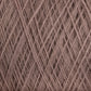 Close-up view of a ball of light brown JaggerSpun Maine Line 3/8 Yarn from Jagger Brothers, Inc. The yarn is tightly wound with visible overlapping strands, creating a textured and interwoven pattern. The fibers appear soft and slightly fuzzy, indicative of the natural or blended fiber composition typical of JaggerSpun yarns.