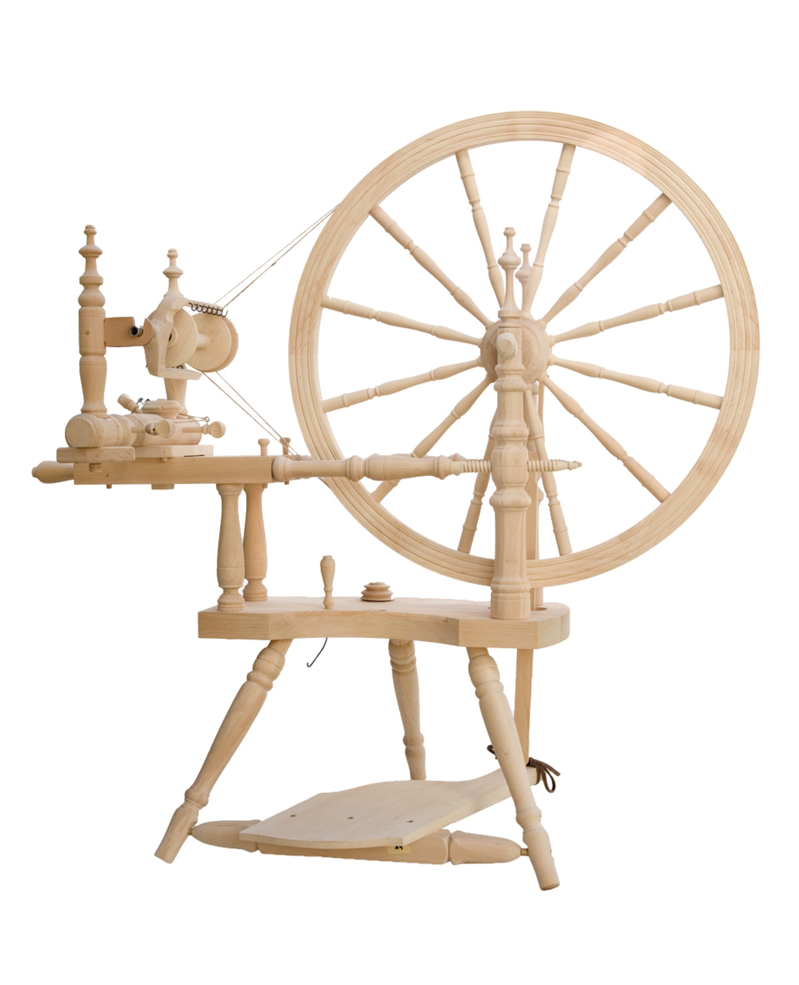 The Kromski Polonaise Spinning Wheel from Kromski North America is a traditional spinning wheel crafted from European alder and birch. It features a large wheel on the right side and includes components such as spindles, a thread guide, and a treadle pedal. The light wood has a smooth, polished finish with intricate turned details, offering both double drive and scotch tensioning options.