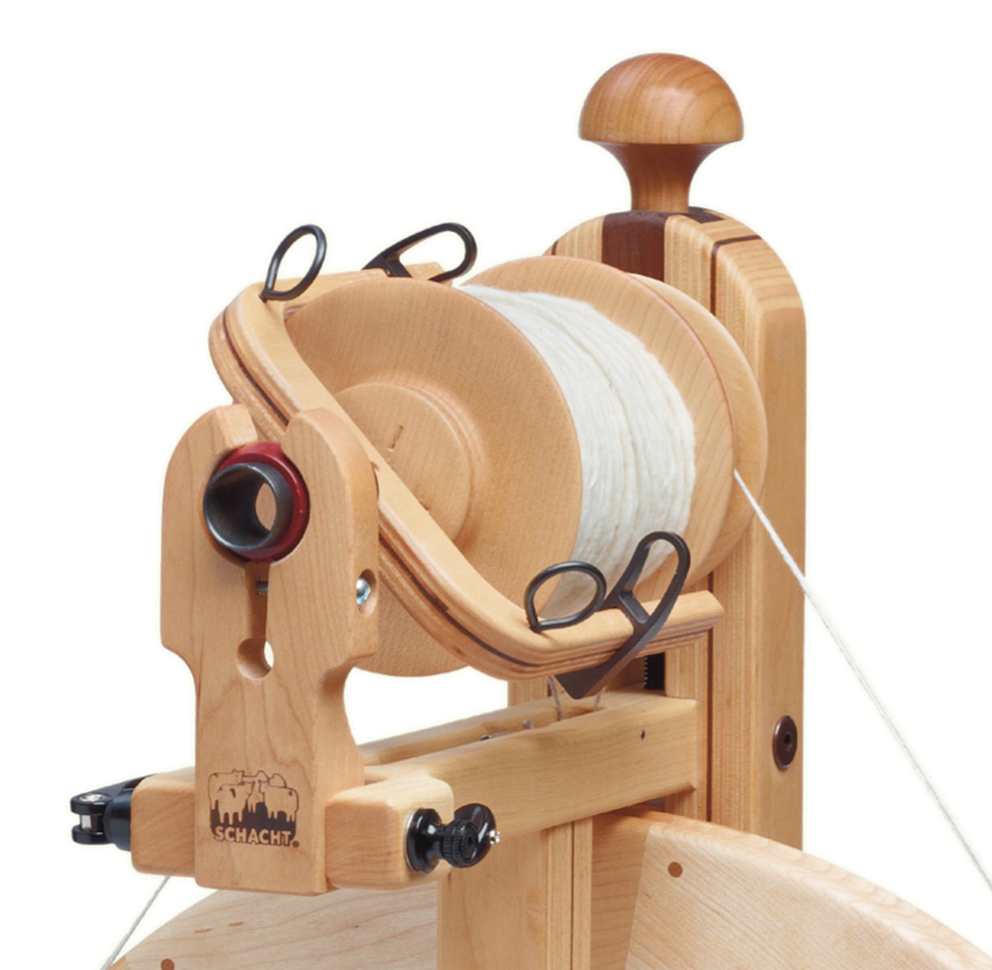 The Schacht Matchless Bulky Plyer Flyer Package by Schacht Spindle Co. features a wooden spinning wheel equipped with a yarn bobbin and flyer assembly. The bobbin is filled with white yarn, and the wheel includes various metal hooks to guide the yarn. The manufacturer's logo is prominently displayed on the wooden surface.