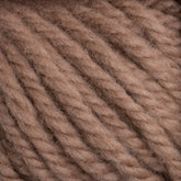 Close-up of a ball of Halcyon Yarn Classic Rug Wool by Caledonian Dye Works in hand-dyed brown. The strands are thick and tightly twisted, highlighting the texture and softness of the material. Perfect for knitting or crocheting cozy items like sweaters or blankets, this Classic Rug Wool is also ideal for rug weavers seeking quality.