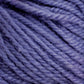 Close-up image of Halcyon Deco Rug Wool from Caledonian Dye Works showcasing the fibers and twist of the 100% wool strands. The texture appears soft and slightly fuzzy. The color is a rich, vibrant shade of purple with subtle variations in tone, creating depth and interest in the material.