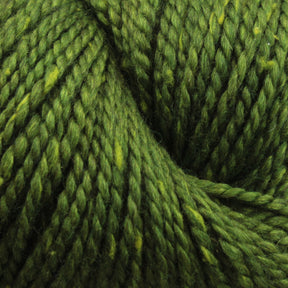 Close-up image of Acadia yarn fibers by The Fibre Co. (UK) Ltd, twisted together, showcasing the texture and subtle tweed effect with slight variations in color from light to dark green.