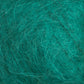 A close-up image showcasing the textured surface of intertwined, fine fibers in a vibrant teal hue from the Victorian Brushed Mohair Yarn by Caledonian Dye Works. The fibers create a chaotic yet soft and fluffy appearance, reminiscent of luxurious mohair or other natural fibrous materials.