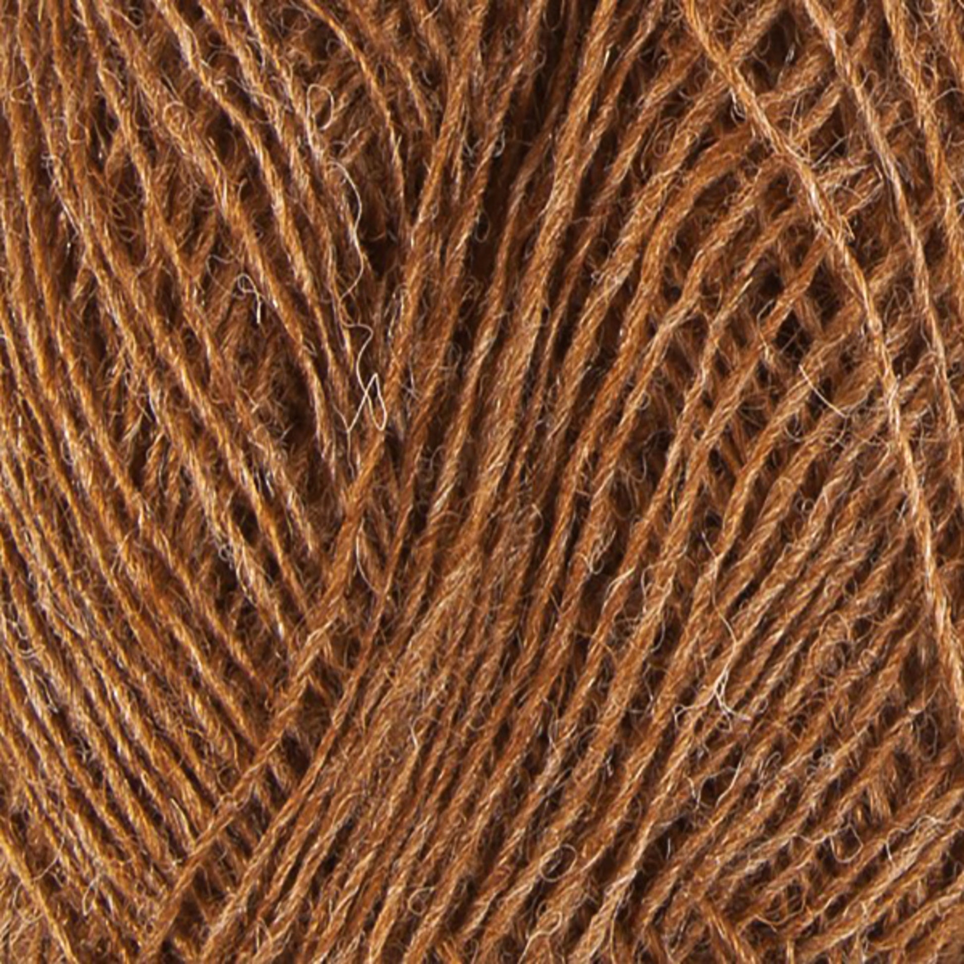 A close-up view of a ball of brown Einband Lopi yarn from Berroco, Inc., showcasing the intertwined strands and texture of the fibers. The yarn appears soft and natural with a slightly rough, fibrous feel, perfect for your next lace knitting project.