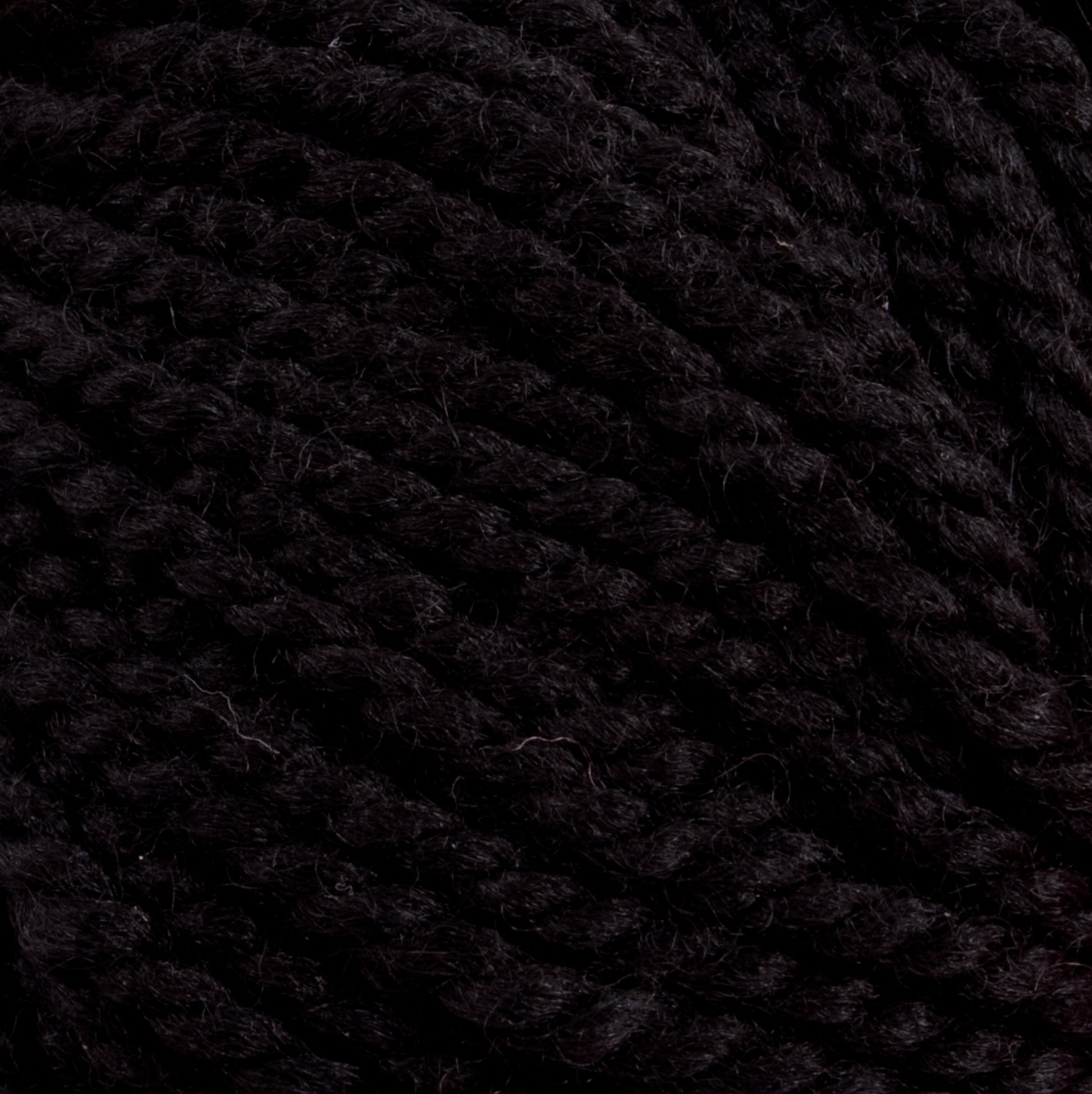 Close-up of a dense, dark black yarn called Norumbega, made by Caledonian Dye Works from 100% U.S. wool. The thick Aran weight yarn strands are twisted together, showing a slightly rough texture. The image focuses on the detailed weave of the durable fabric, highlighting the intricate details and the deep, rich color of the Norumbega yarn.