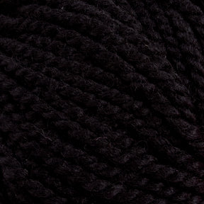 Close-up of a dense, dark black yarn called Norumbega, made by Caledonian Dye Works from 100% U.S. wool. The thick Aran weight yarn strands are twisted together, showing a slightly rough texture. The image focuses on the detailed weave of the durable fabric, highlighting the intricate details and the deep, rich color of the Norumbega yarn.